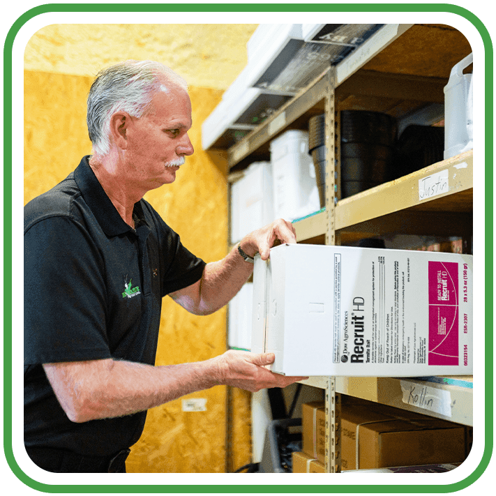 Innovative pest control technician getting chemicals from the storage